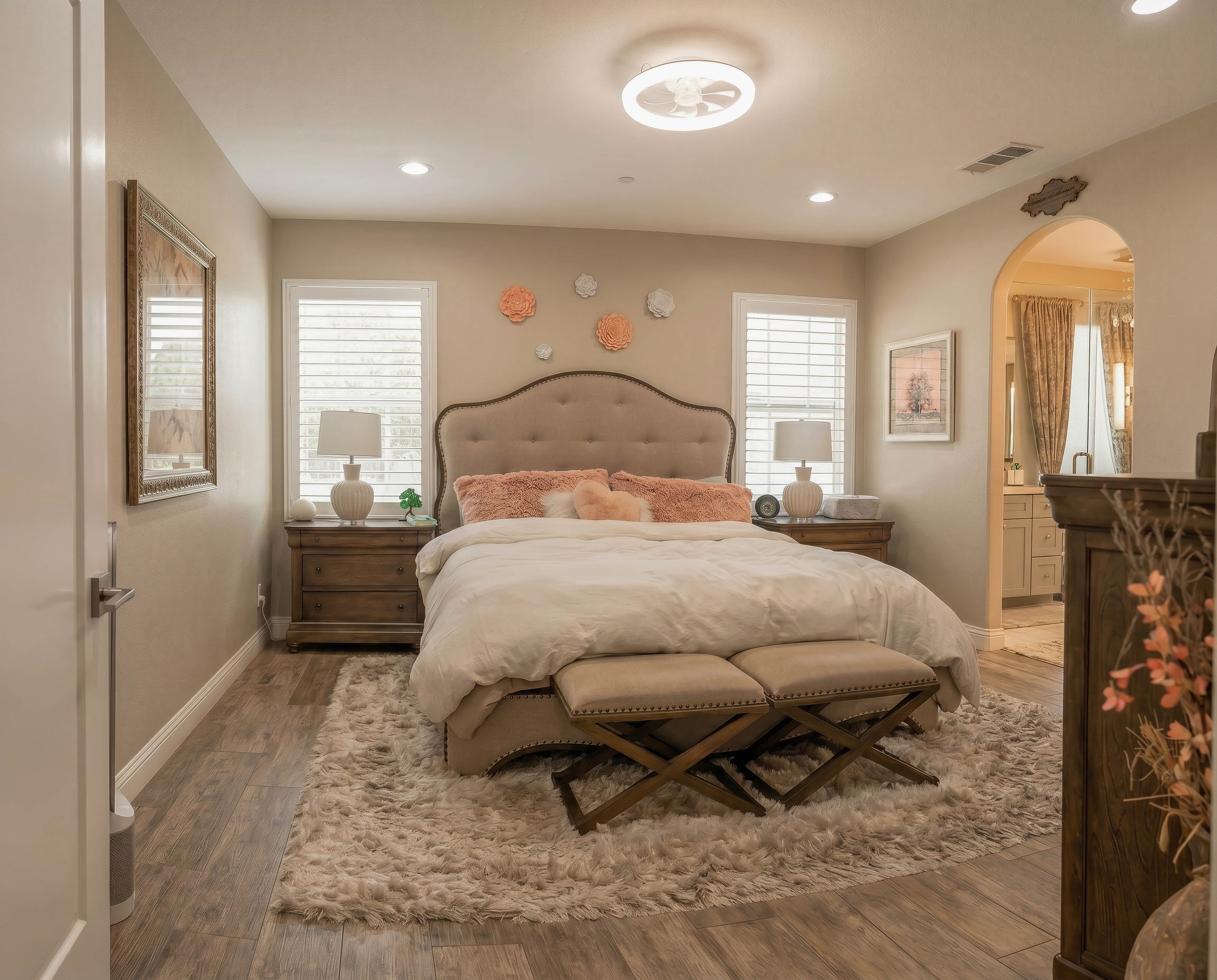 Primary bedroom with elegant headboard