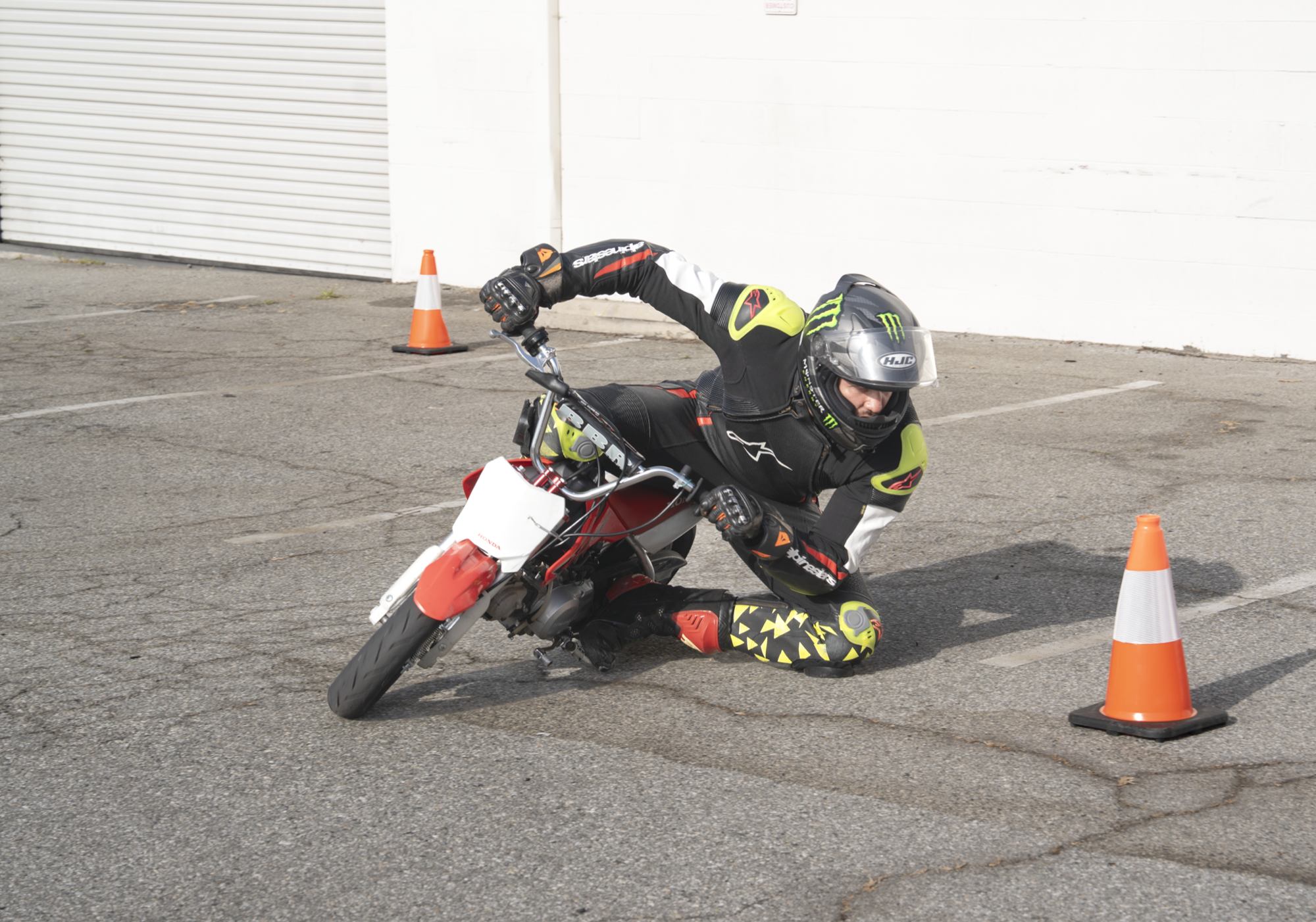 Rider in extreme lean — The Curve Syndicate